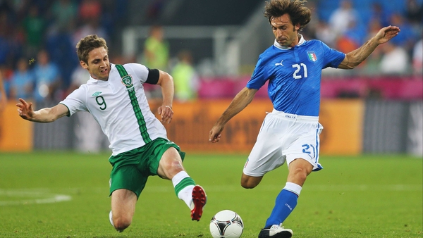 Kevin Doyle and Andrea Pirlo clash