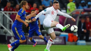 England's Wayne Rooney with Ukraine's Yaroslav Rakitsky