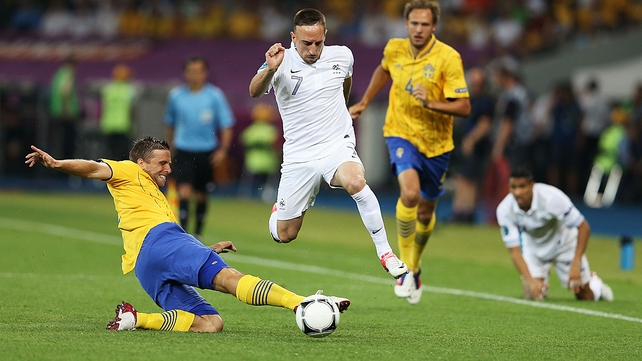 France's Frank Ribery skips past the challenge of Anders Svensson