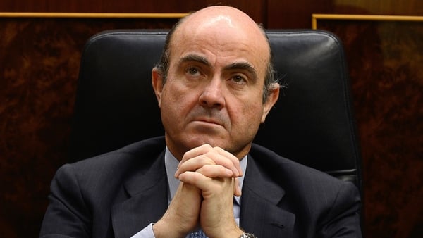 European Central Bank vice president Luis de Guindos said that low interest rates will continue squeezing euro zone banks' profitability in the foreseeable future