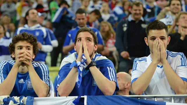 Greek supporters come to terms with their side's exit for Euro 2012