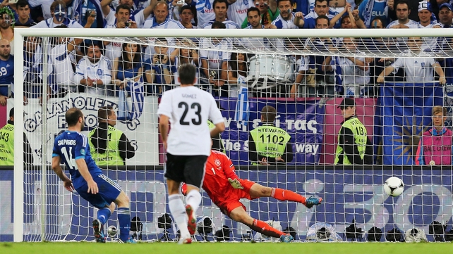 Dimitris Salpingidis scores a consolation goal for Greece from the penalty spot