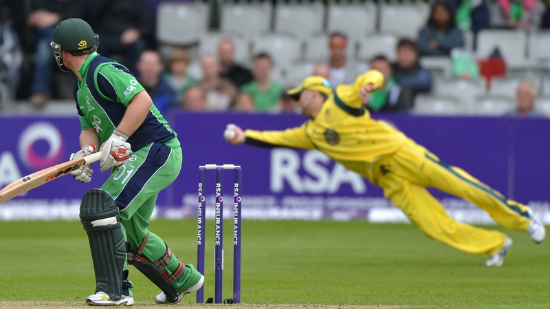 Ireland's Paul Stirling looks round as Michael Clarke of Australia takes a diving catch