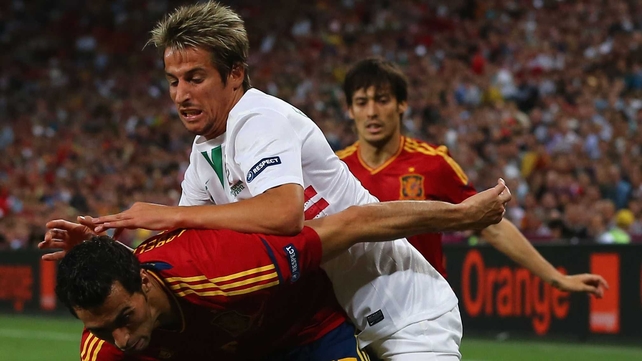 Fabio Coentrao is held off by Alvaro Arbeloa