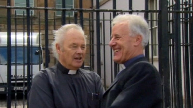 Eugene Boland, right, said he looked forward to resuming parish duties