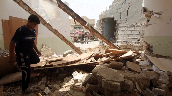 A bomb attack south of Baghdad killed at least eight people yesterday