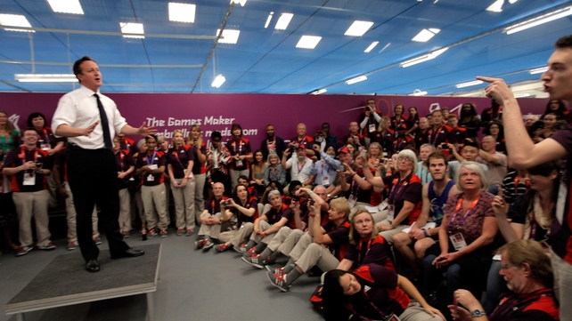 British Prime Minister David Cameron is heckled during a speech to Olympic volunteers in London