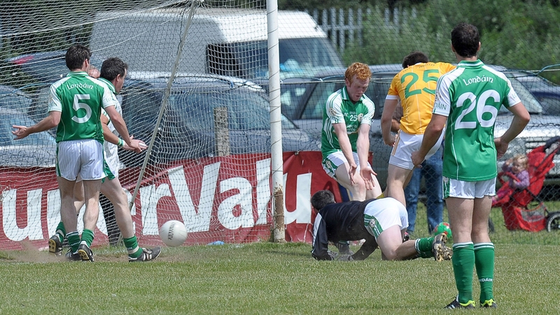 Kevin Niblock scores the decisive goal for Antrim