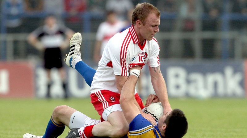 Derry's Martin Donaghy and Shane Mulligan of Longford exchange pleasantries at Pearse Park