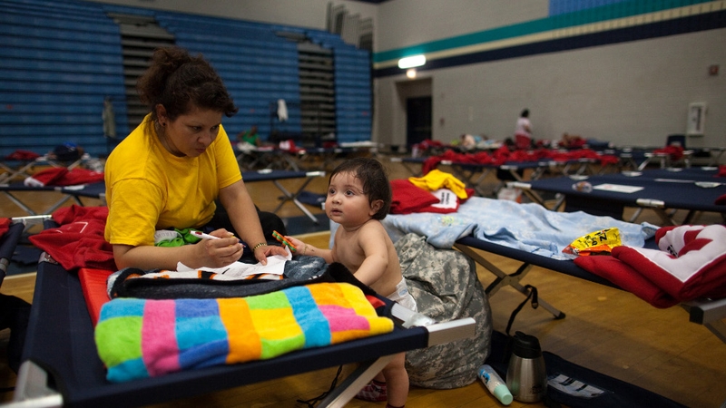 A mother and son rest in a Red Cross shelter after power was knocked out to thousands of homes in Maryland