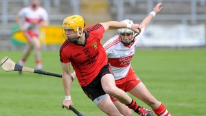 Down's Michael Turley is chased down by Derry's Conor McSorley