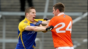 Roscommon's Seanie McDermott and Gavin McParland of Armagh test the quality of each other's jerseys