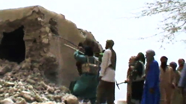 A still from a video showing the destruction of an ancient shrine in Timbuktu