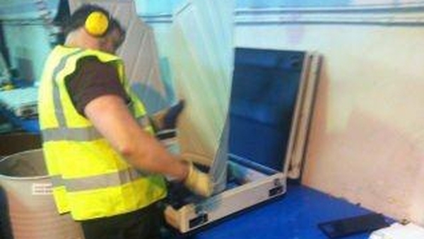 Staff at KMK Metals Recycling are dismantling the machines