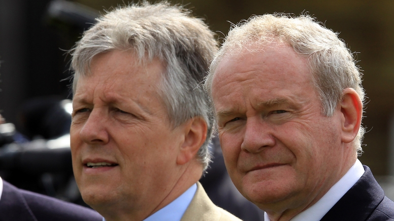 Peter Robinson (L) questioned the nature of the planned investigation