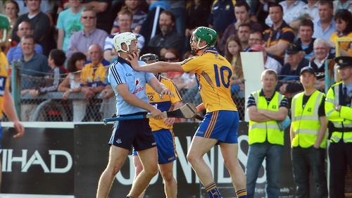 Michael Carton of Dublin and Fergal Lynch of Clare clash off the ball