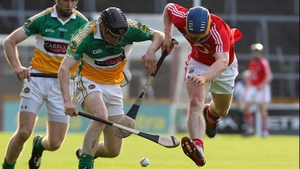 Cork's Darren Sweetnam and Brendan Murphy of Offaly tussle for possession