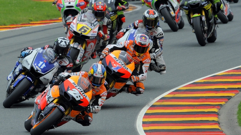 Spain's Dani Pedrosa of Repsol Honda Team (front) leads the pack
