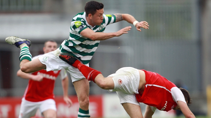 Billy Dennehy of Rovers with Greg Bolger of Pat's
