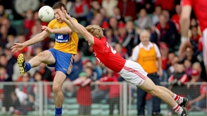 Cork's Denis O'Brien executes a brilliant block to deny Gary Brennan