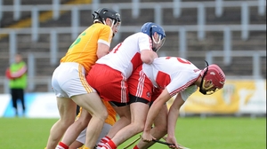 Antrim's Niall McAuley with Derry's Kevin Hinphey and Paddy McCloskey get up close and personal in the Ulster senior final