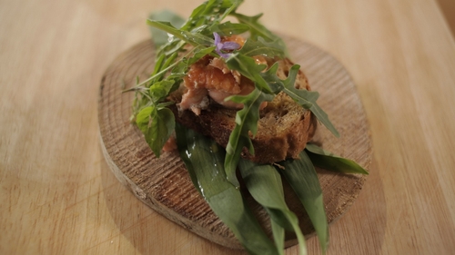 Martin Shanahan's Grilled Sea Trout served on Artisan Bread on a Bed of Wild Mixed Leaves