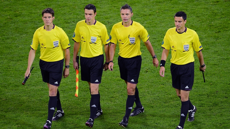 UEFA have no plans to dispense with the use of assistant referees for the time being