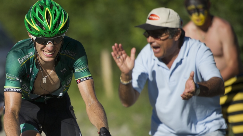 Stage winner Pierre Rolland is cheered on by a fan