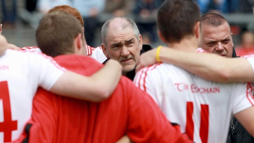 Tyrone manager Mickey Harte has a few words of encouragement for his charges before throw-in at Dr Hyde Park