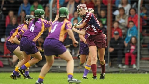 Aislinn Connolly gets her strike away under pressure from three Wexford players