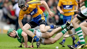 Limerick's Niall Moran loses his footing under pressure from Patrick Donnellan of Clare