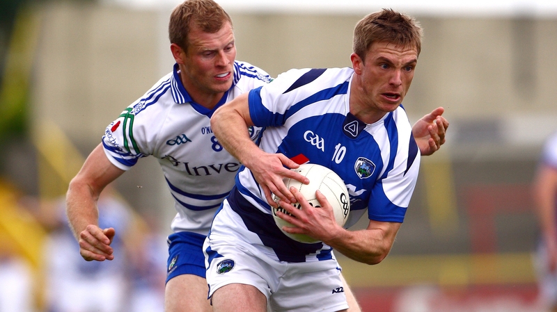 Ross Munnelly of Laois shields the ball from Monaghan's Owen Lennon