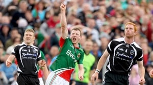 Sligo's Johnny Martin and Ross Donovan look on as Mayo's Colm Boyle celebrates a late score