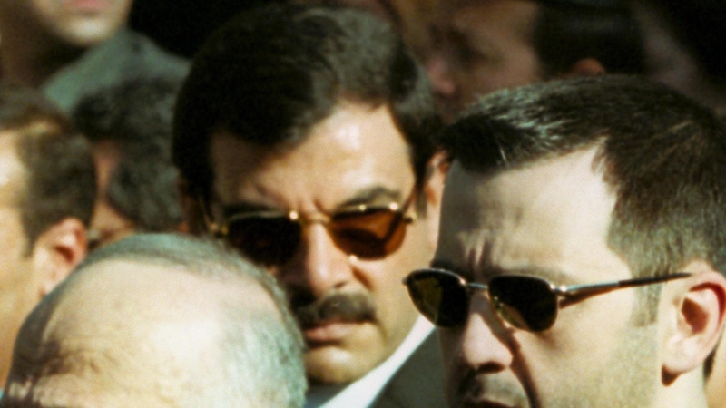 This file picture from 2000 shows Assef Shawkat (C) with Bashar al-Assad's younger brother Maher in the foreground