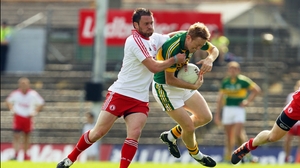 Tyrone's Martin Penrose tried to get to grips with Colm 'Gooch' Cooper