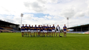 The Tipperary footballers stand to attention for the national anthem at Semple Stadium