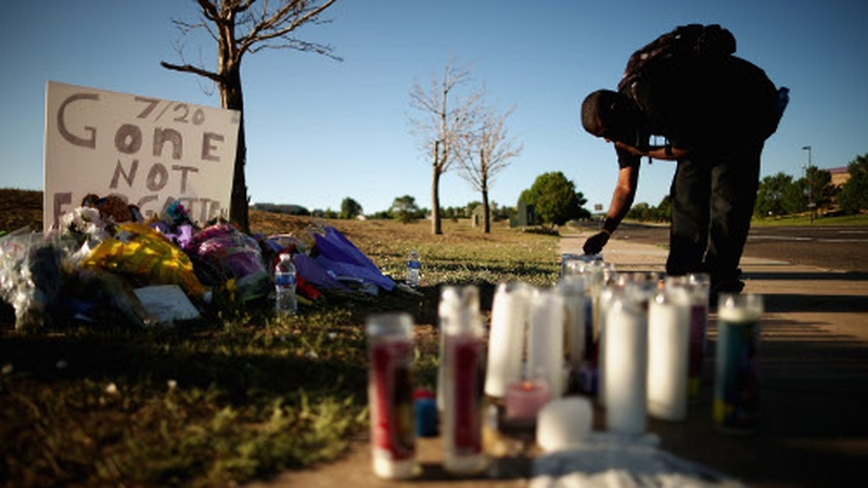 A makeshift memorial has been left across the street from where yesterday's massacre took place
