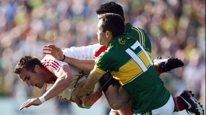 Kerry's Brian Maguire and Aidan O'Mahony put Mark Donnelly of Tyrone under pressure