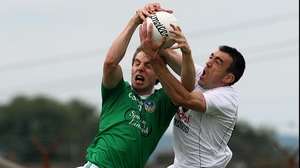 Kildare's Johnny Doyle (r) and Seanie Buckley of Limerick compete for an aerial ball