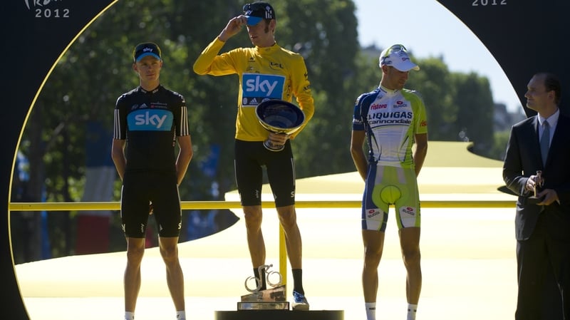 Second-placed Christopher Froome, winner Bradley Wiggins, and third-placed Vincenzo Nibali