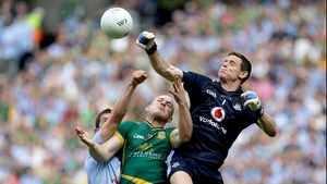 Dublin goalkeeper Stephen Cluxton and Rory O'Carrroll contest a high ball with Joe Sheridan of Meath