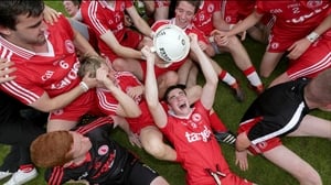 Tyrone's minor captain Michael Cassidy celebrates with team-mates after their 0-14 to 1-08 victory