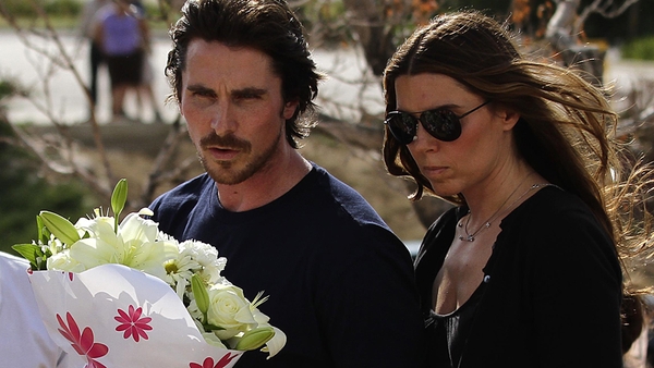 Bale and wife Sibi Blazic - Paid their respects at a memorial to the 12 people who died in the massacre