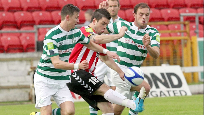 Derry's Owen Morrison comes under pressure from Ronan Finn and Stephen Rice of Rovers