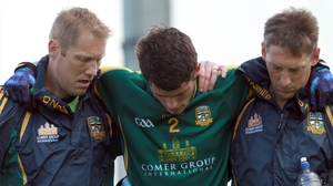 Donal Keogan was led from the pitch by former Meath greats Graham Geraghty and Trevor Giles