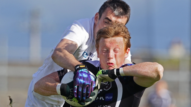 John Doyle tries to steal the ball from Charlie Harrison in what prove a one-sided clash in Hyde Park