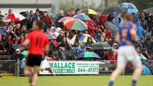 Fans took shelter from the rain in the midlands