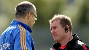Down manager James McCartan (r) commiserates with his Tipperary counterpart Peter Creedon