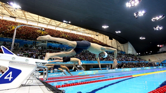 Sun Yang of China dives off of the starting block as he competes in heat four of the Men's 400m Freestyle