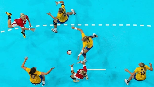 Rikke Skov of Denmark passes the ball in the Women's Handball preliminaries Group B - Match 4 between Denmark and Sweden